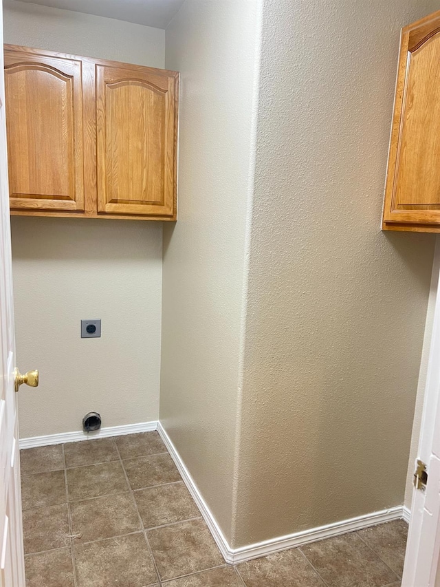 laundry area with cabinets and hookup for an electric dryer