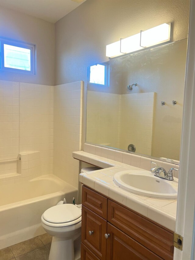 full bathroom with toilet, tile patterned flooring, shower / bathtub combination, and vanity