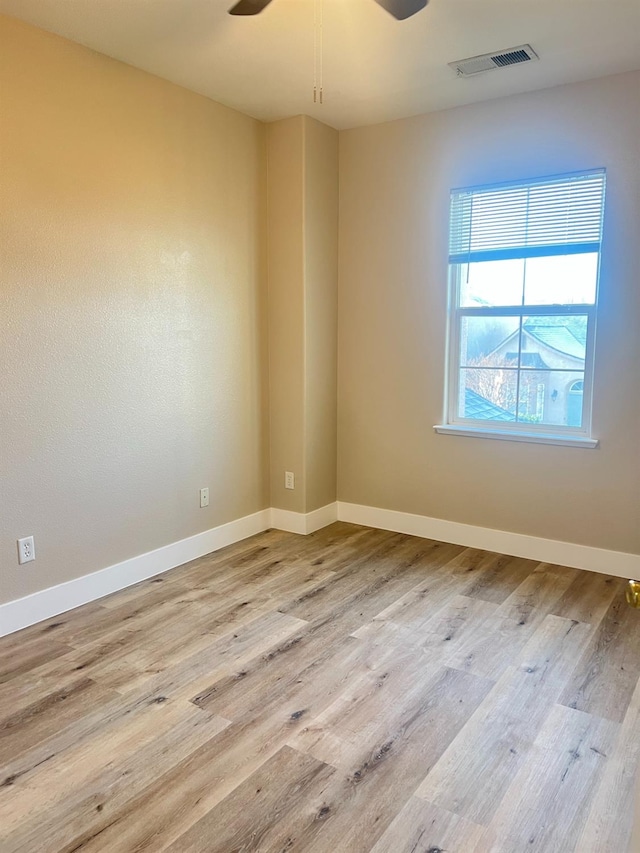 spare room with ceiling fan and light hardwood / wood-style floors