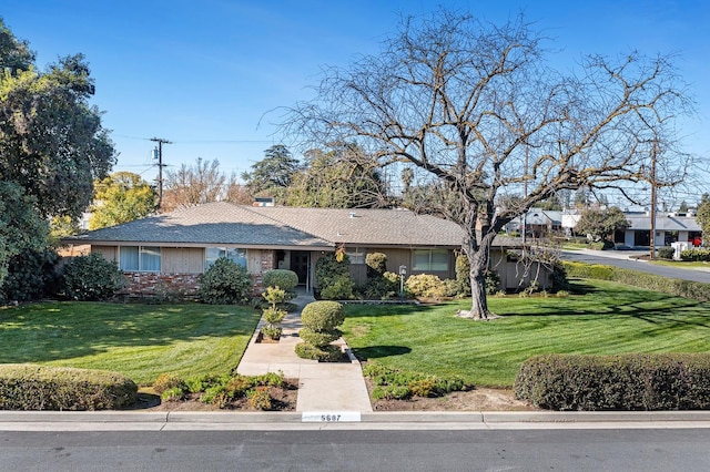 single story home with a front yard