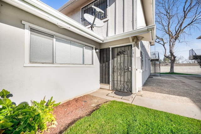 property entrance featuring a patio area