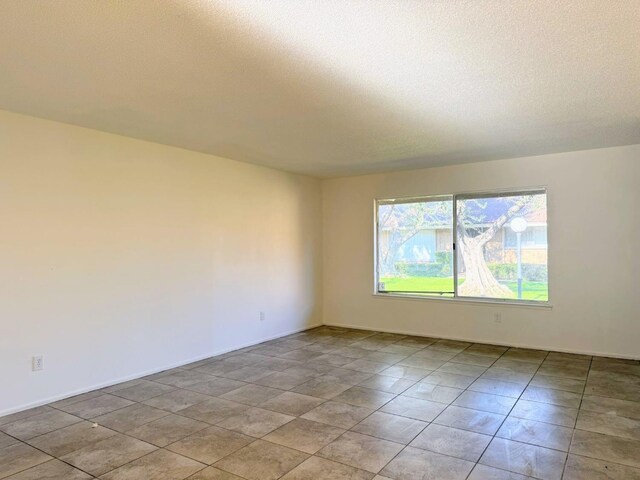 empty room with a textured ceiling