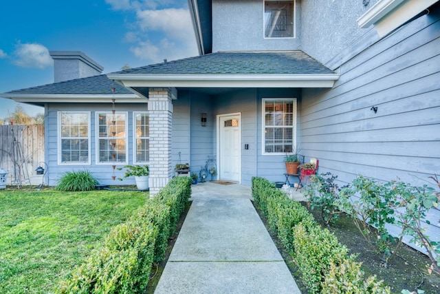 entrance to property with a yard