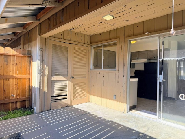 entrance to property featuring a patio area