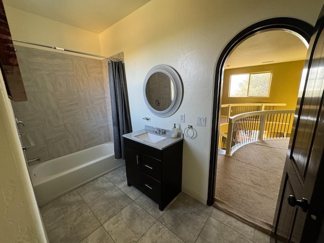 bathroom with vanity, tile patterned flooring, and shower / bath combo with shower curtain