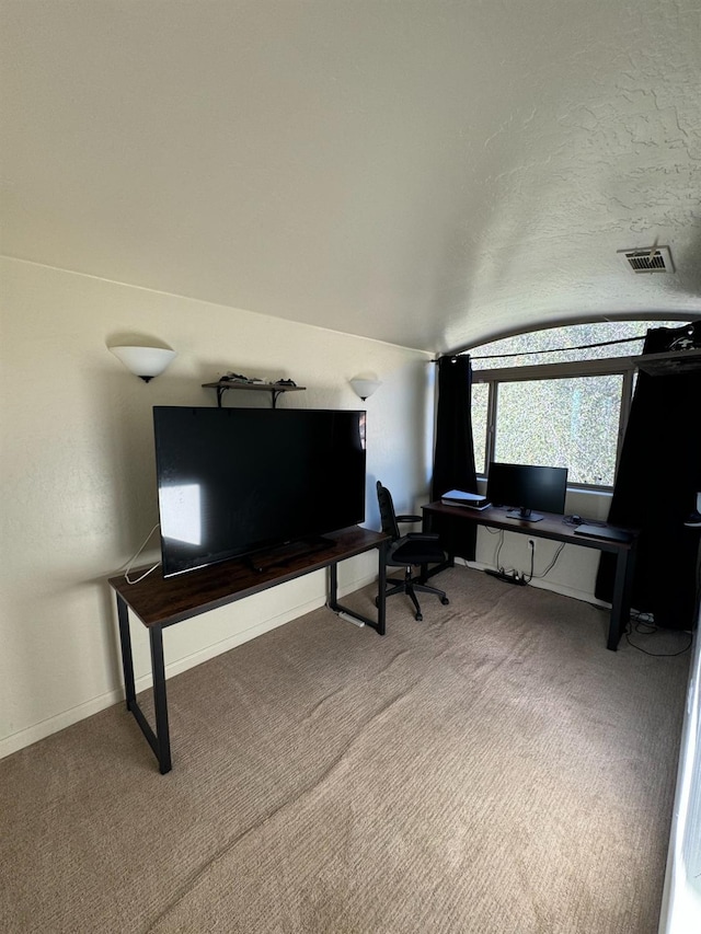 office area with lofted ceiling and carpet