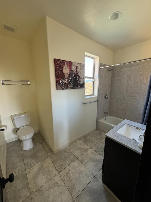 full bathroom featuring toilet, vanity, and tiled shower / bath combo