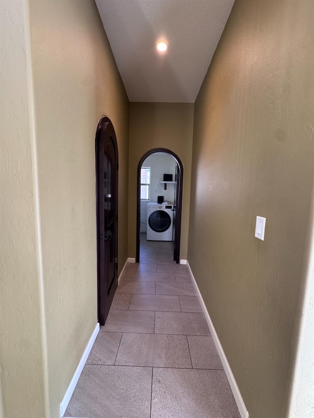 corridor featuring washer / dryer