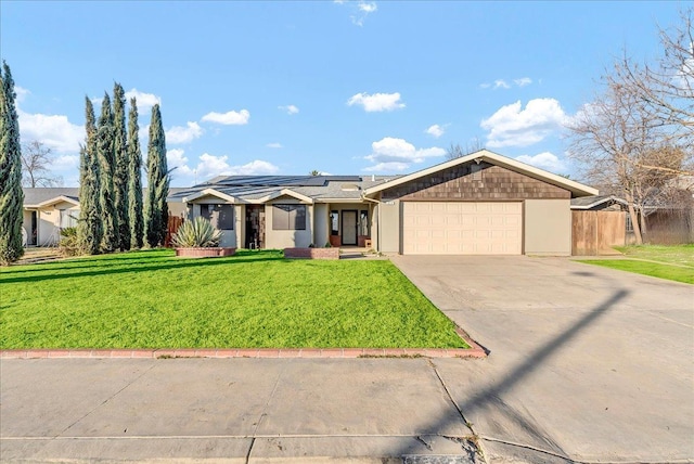 ranch-style home featuring a front lawn and a garage