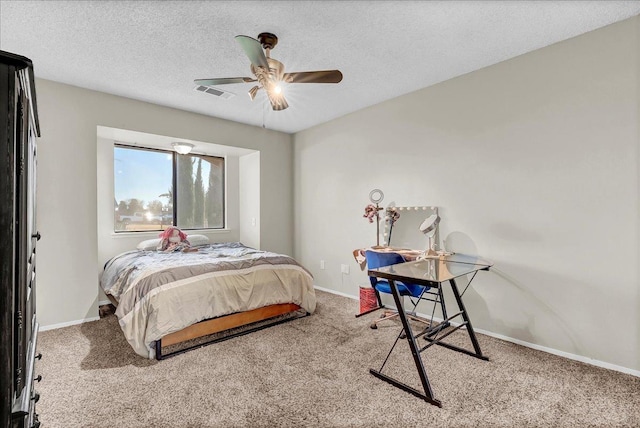 bedroom featuring a textured ceiling, ceiling fan, and carpet flooring