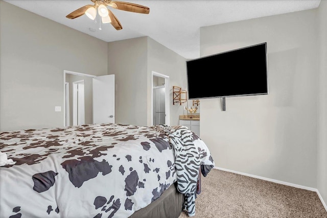 bedroom featuring ensuite bath, carpet floors, and ceiling fan