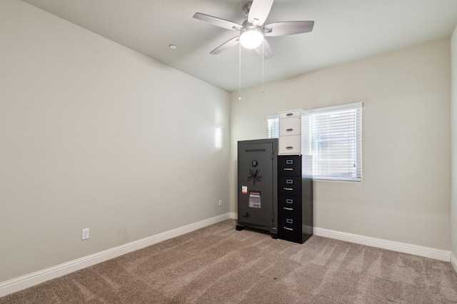 interior space featuring ceiling fan and light colored carpet