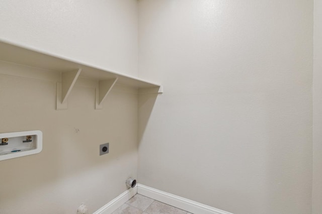 laundry area featuring hookup for a washing machine, light tile patterned flooring, and hookup for an electric dryer