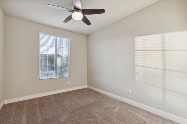 empty room featuring ceiling fan and carpet flooring