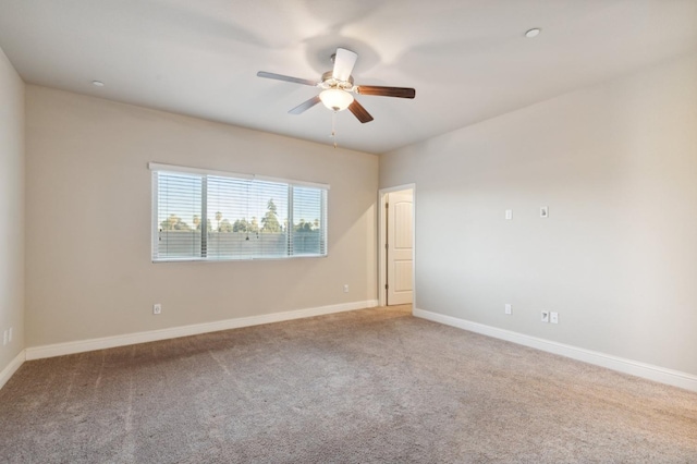 unfurnished room featuring carpet floors and ceiling fan