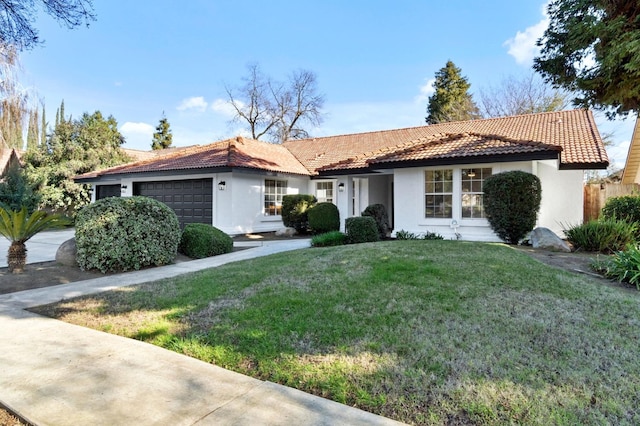 view of front of house with a front lawn and a garage