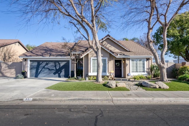 view of front facade featuring a garage and a front lawn