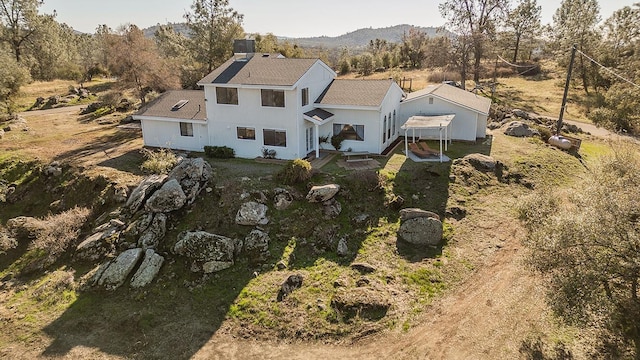 birds eye view of property with a mountain view