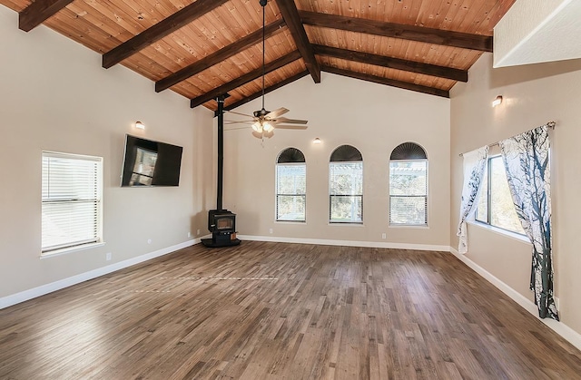 unfurnished living room featuring high vaulted ceiling, wooden ceiling, wood finished floors, baseboards, and a wood stove