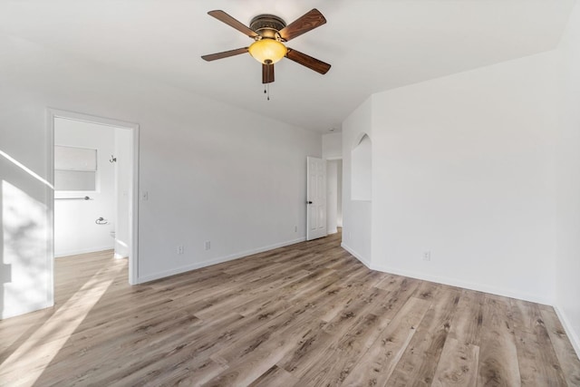 spare room featuring ceiling fan and light hardwood / wood-style floors