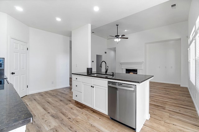 kitchen featuring white cabinetry, dishwasher, light hardwood / wood-style flooring, and sink