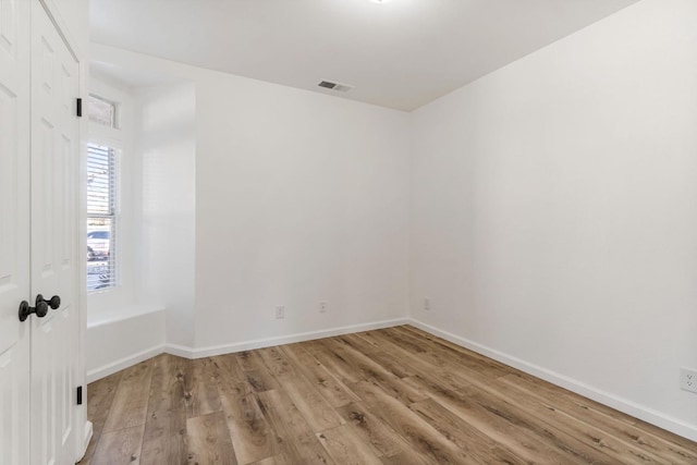 unfurnished room featuring light wood-type flooring