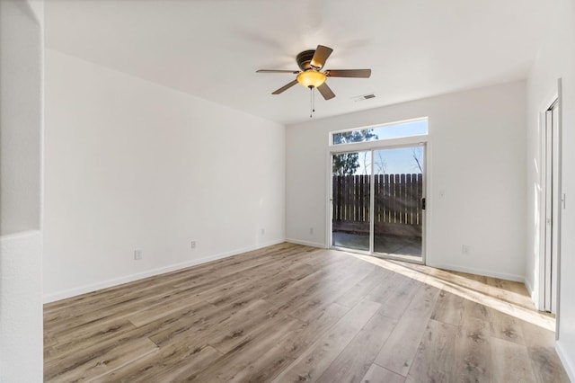 spare room featuring ceiling fan and light hardwood / wood-style floors