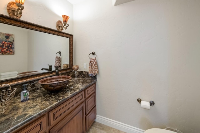 bathroom with toilet and vanity