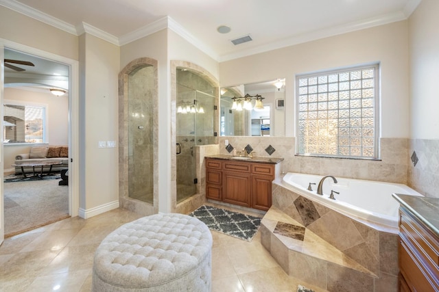 bathroom featuring tile patterned floors, vanity, ceiling fan, crown molding, and separate shower and tub