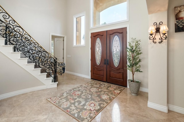 foyer with a towering ceiling