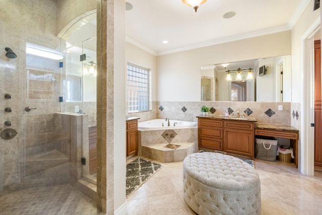 bathroom featuring vanity, tile patterned flooring, ornamental molding, and shower with separate bathtub