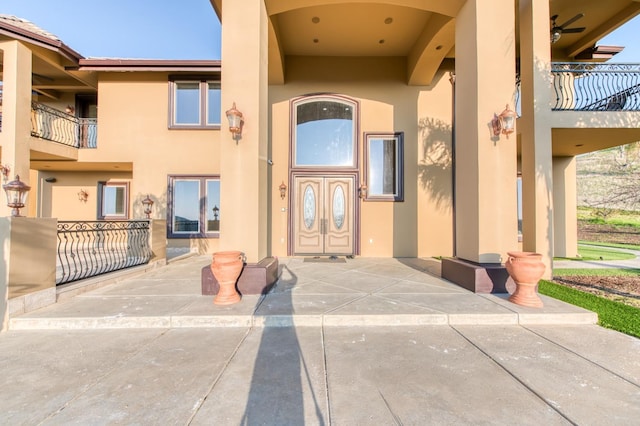 property entrance featuring a patio area