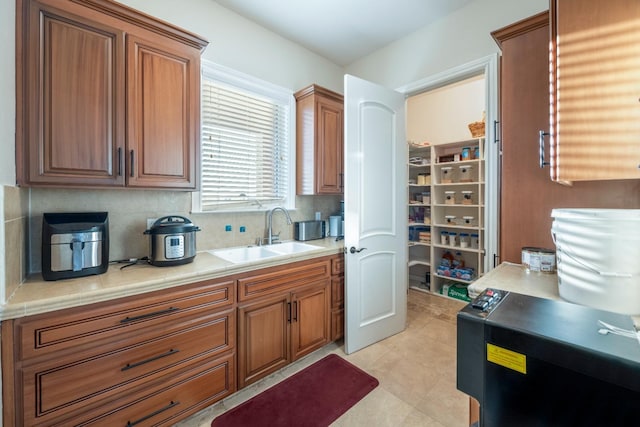 kitchen with tasteful backsplash and sink