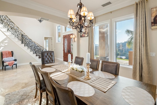 dining area featuring a chandelier and ornamental molding