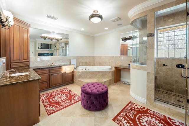 bathroom featuring shower with separate bathtub, crown molding, vanity, and tile patterned flooring