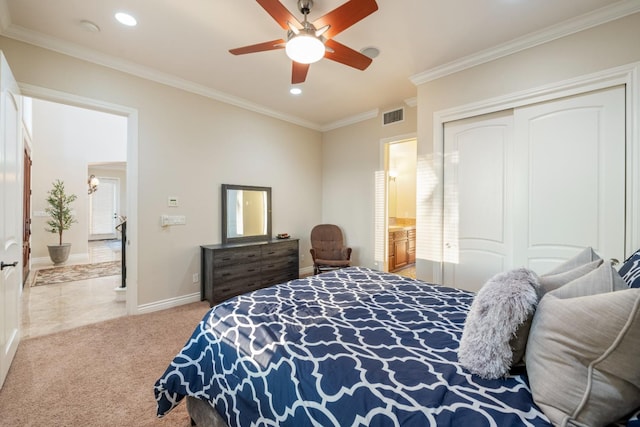 bedroom with ceiling fan, light colored carpet, a closet, and ornamental molding