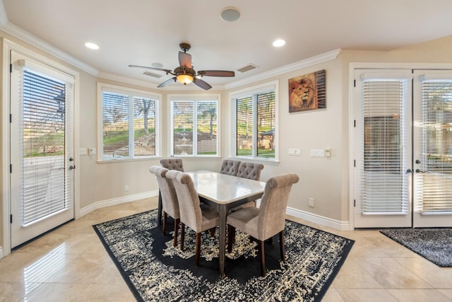 dining area featuring ceiling fan, crown molding, and light tile patterned flooring