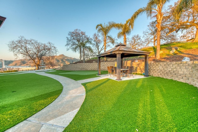 view of yard featuring a gazebo, a mountain view, and a patio