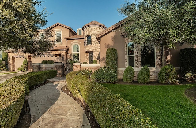 mediterranean / spanish house featuring a garage