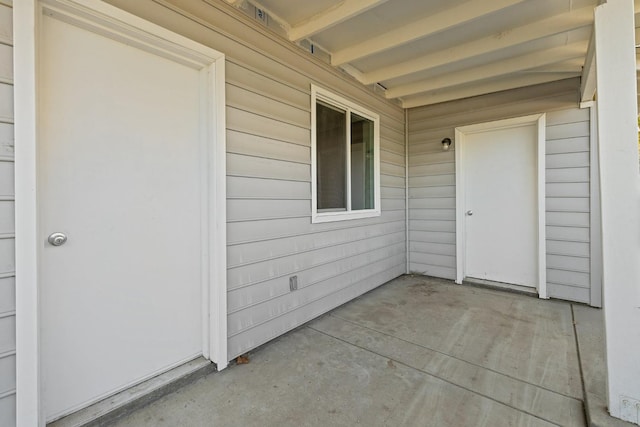 entrance to property with a patio