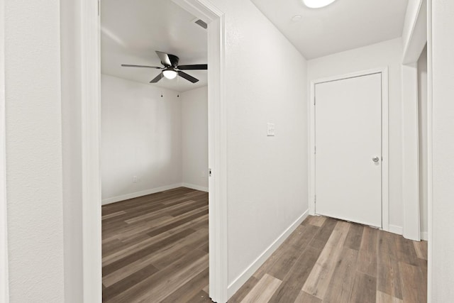 hallway featuring dark wood-type flooring