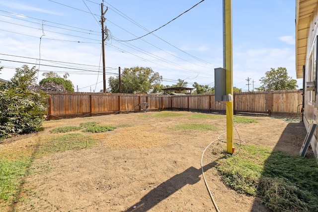 view of yard with a fenced backyard