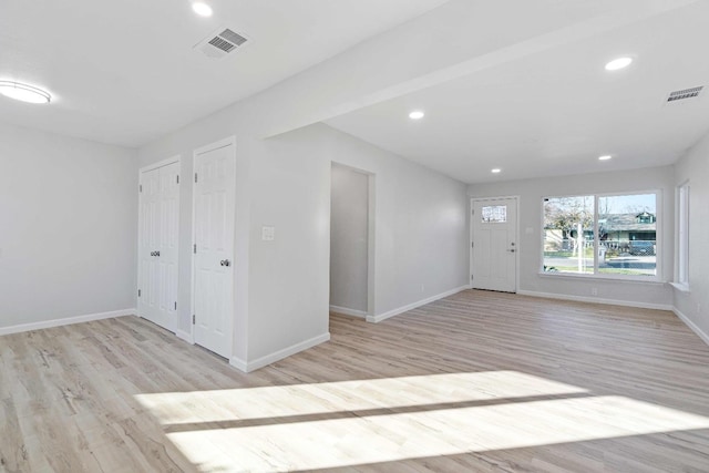 unfurnished room with light hardwood / wood-style floors