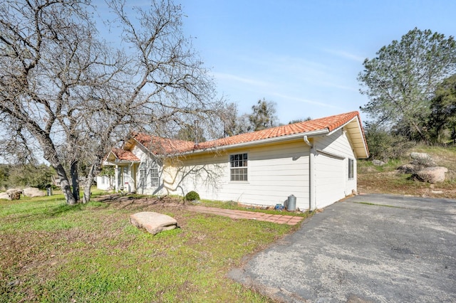 view of home's exterior featuring a yard