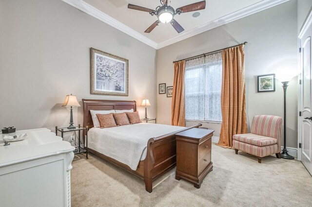 carpeted bedroom featuring ceiling fan and crown molding