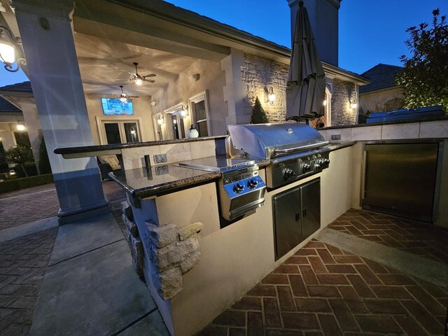 view of patio / terrace with a grill and an outdoor kitchen