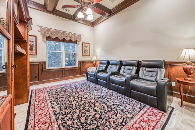 cinema with ceiling fan, beam ceiling, ornamental molding, and coffered ceiling