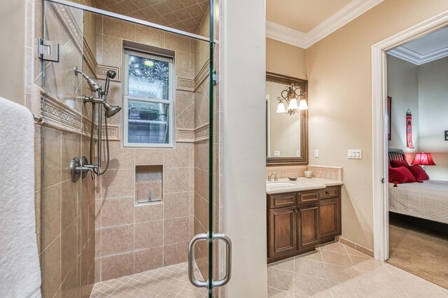 bathroom featuring an inviting chandelier, tile patterned flooring, an enclosed shower, crown molding, and vanity