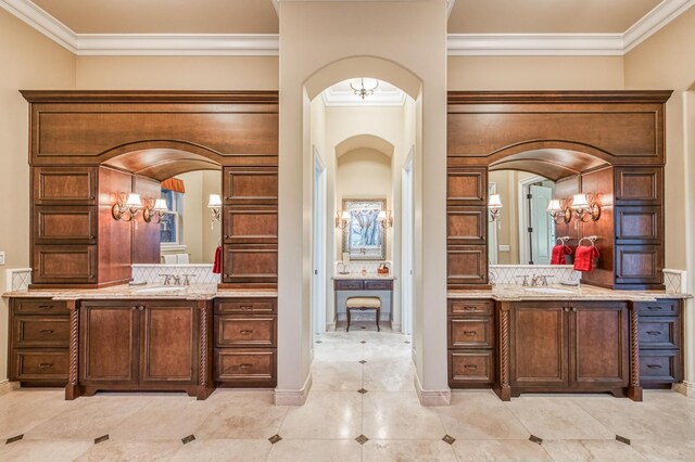 bathroom featuring crown molding, tile patterned floors, and vanity