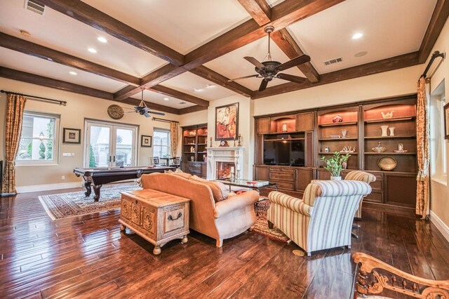 living room featuring ceiling fan, dark hardwood / wood-style flooring, pool table, and beamed ceiling